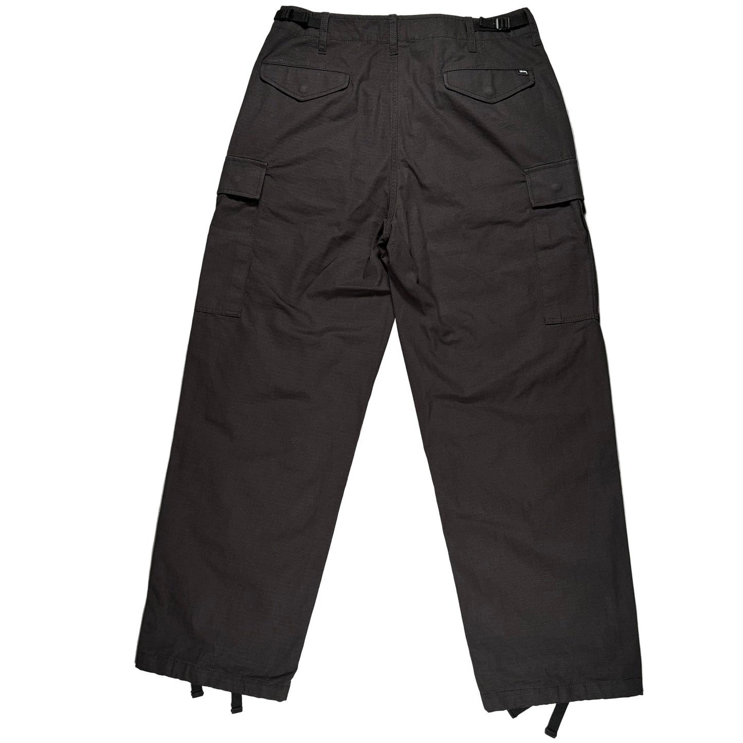 Black cargo pants on a white surface