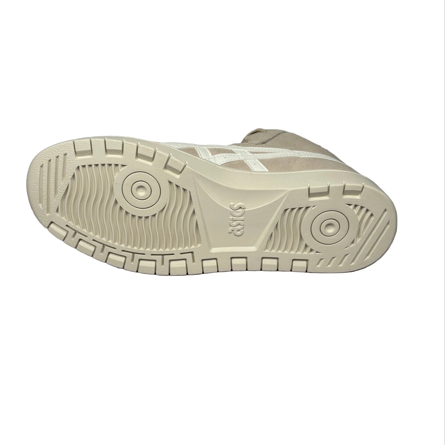 Close-up of a beige sneaker sole on a white background