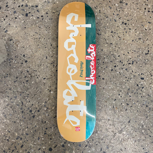 white Chocolate logo on yellow and green wood grain skate deck