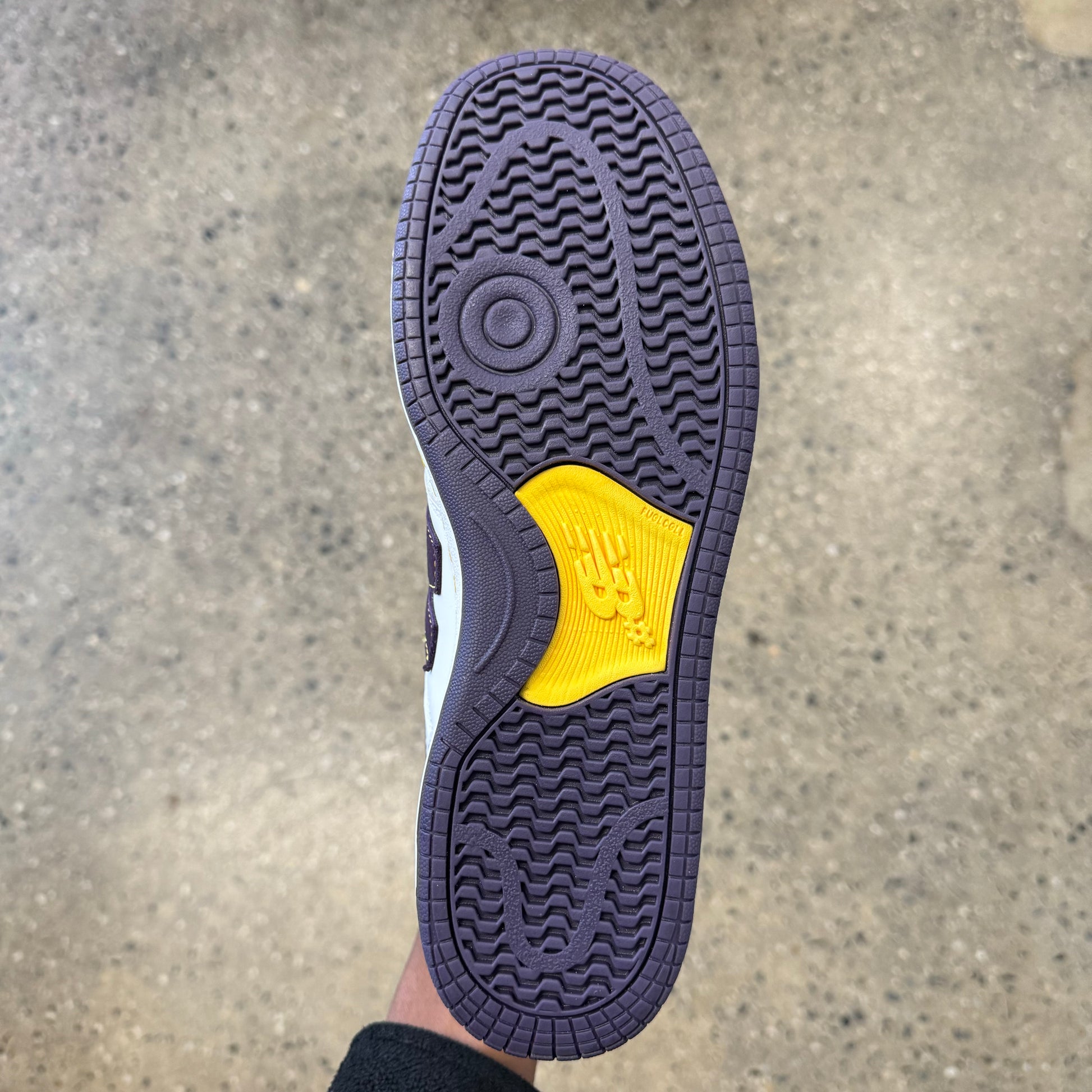 purple and yellow sole, bottom of sneaker