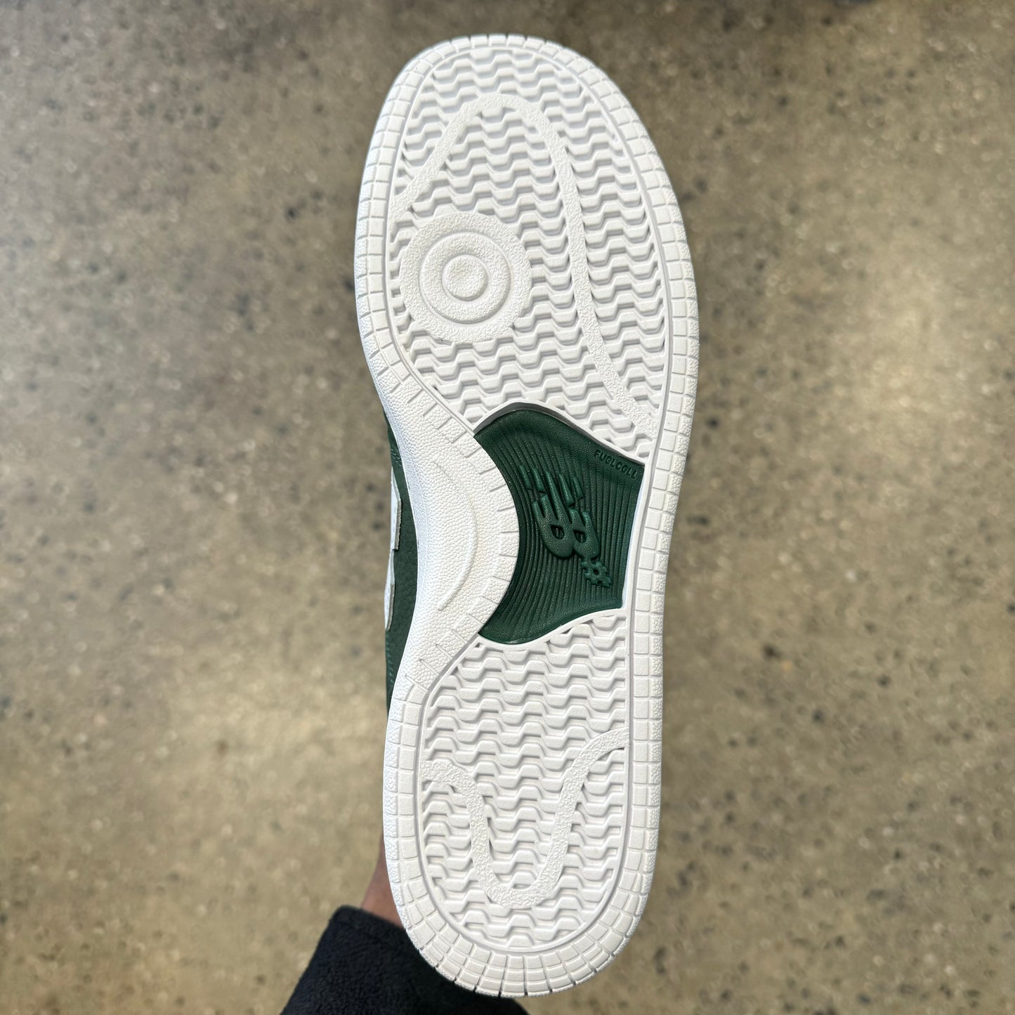 white and green sole, bottom of sneaker