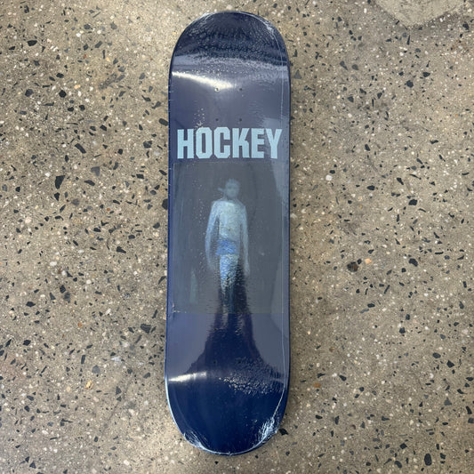 white ghost creature on navy skate deck