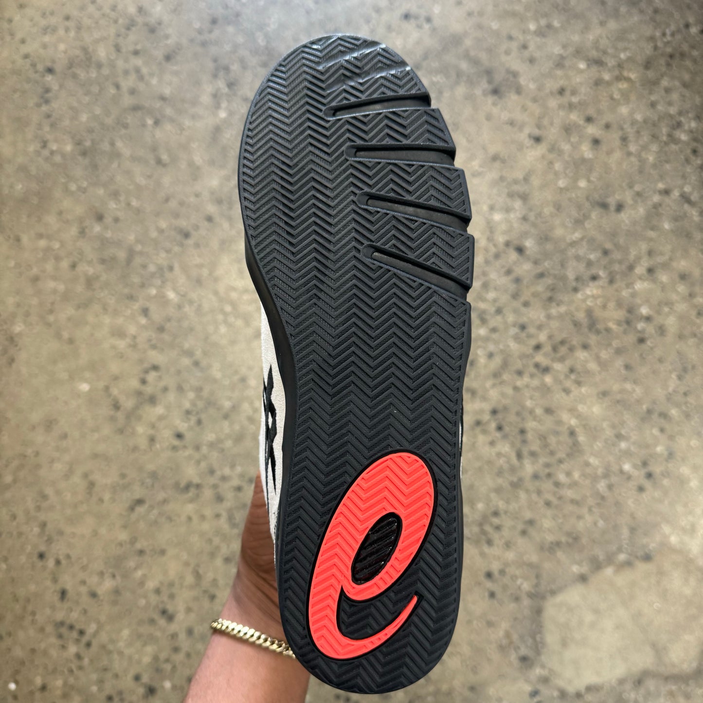 black and red sole, bottom of sneaker
