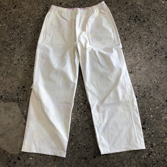 white pants with reversible abstract design