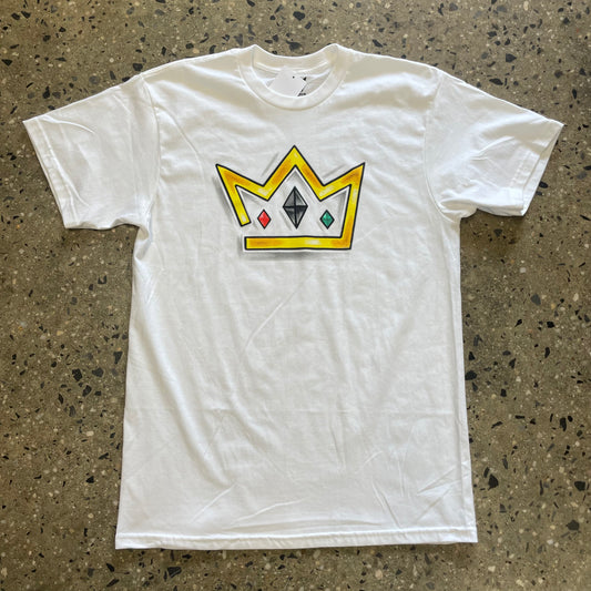 gold crown with red, black, and green gemstones on white T-shirt
