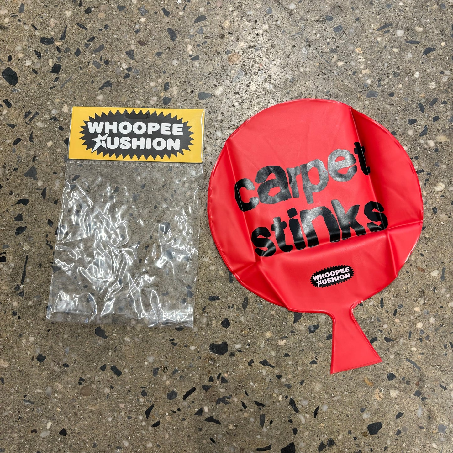 carpet stinks written on red whoopie cushion