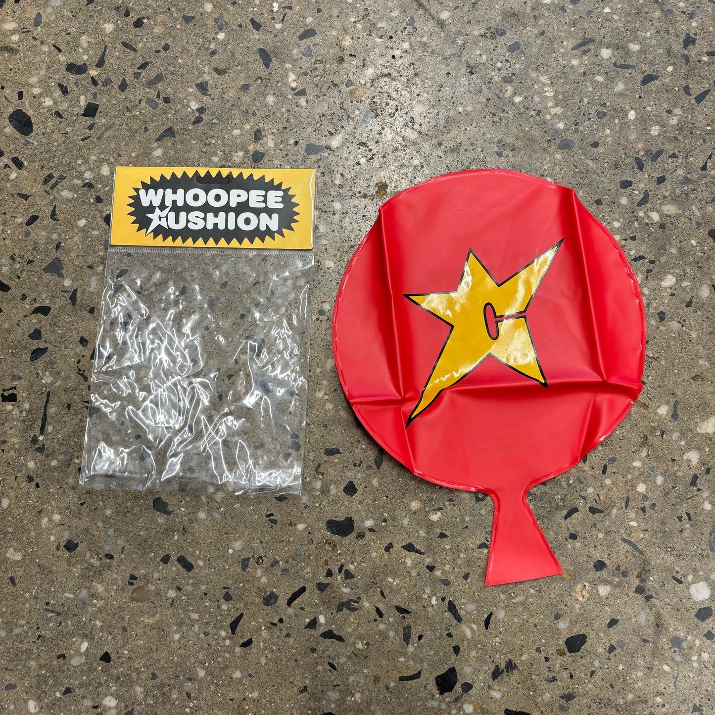 C-logo whoopie cushion prank device in red and yellow
