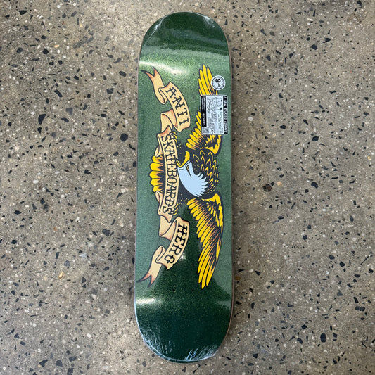 yellow and black spead eagle logo on green metallic skate deck