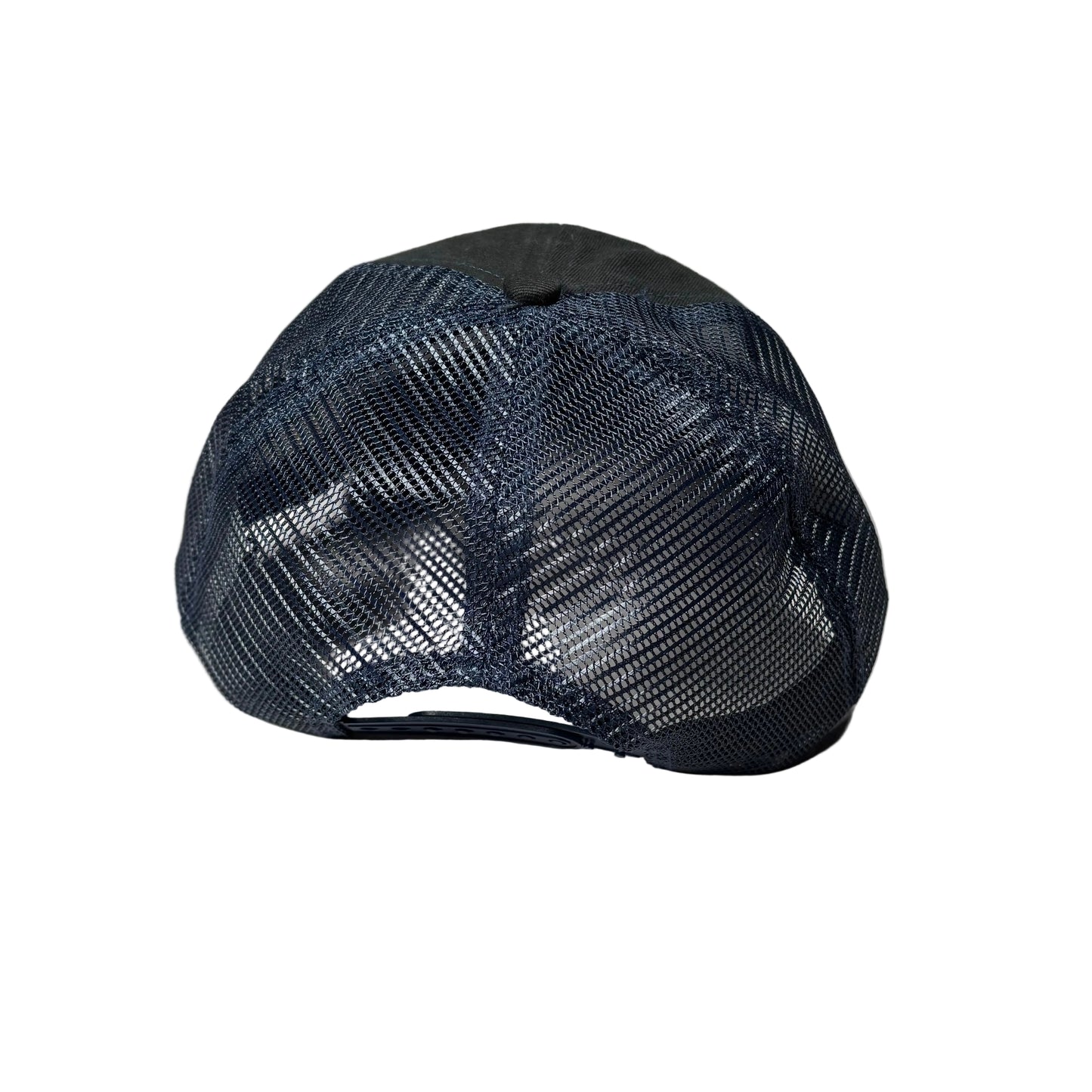 Black mesh cap on a white surface