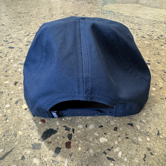 back view of navy hat with snap closure