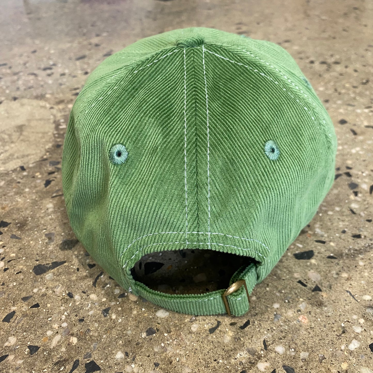 rear view of green corduroy six panel cap