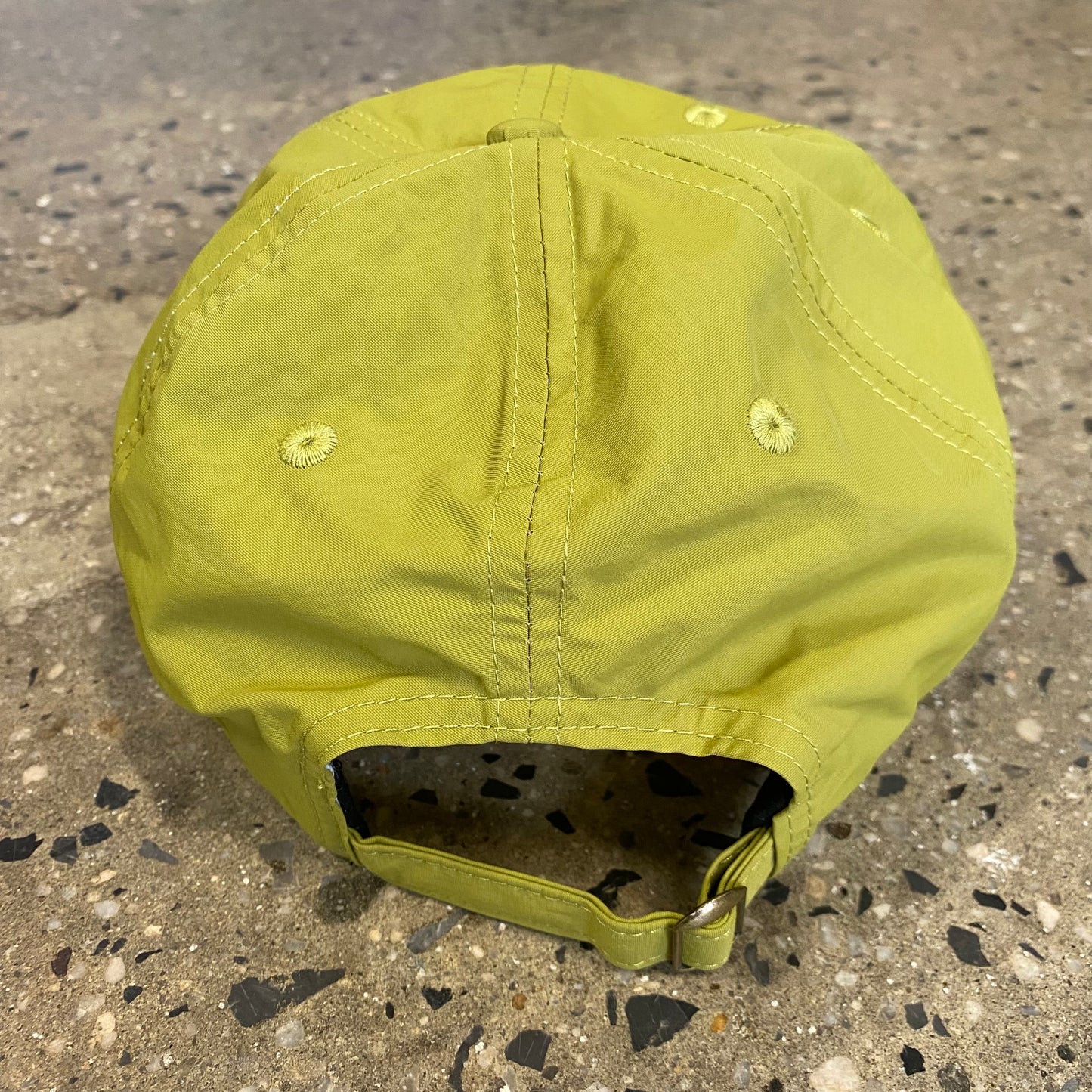 Rear view of green six panel cap