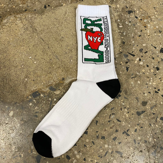 Green, black and red LABOR apple logo on upper part of white and black sock