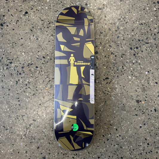 black, yellow, brown abstract design on skate deck