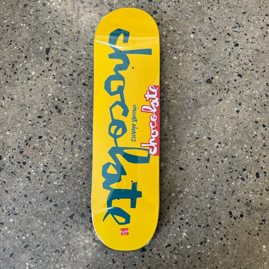blue logo on yellow skate deck
