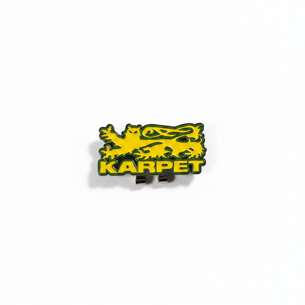 Yellow and black 'Karpet' logo pin on a white background