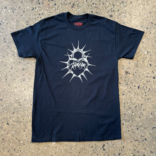black t shirt with white spiky heart in the center