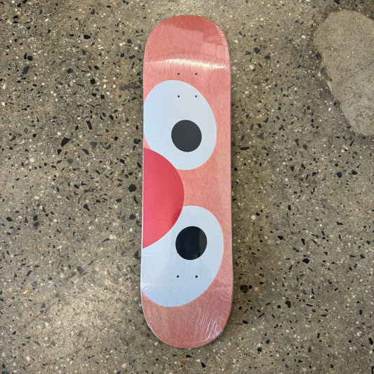 all over orange fuzz print skateboard deck with white eyes and red nose in the center