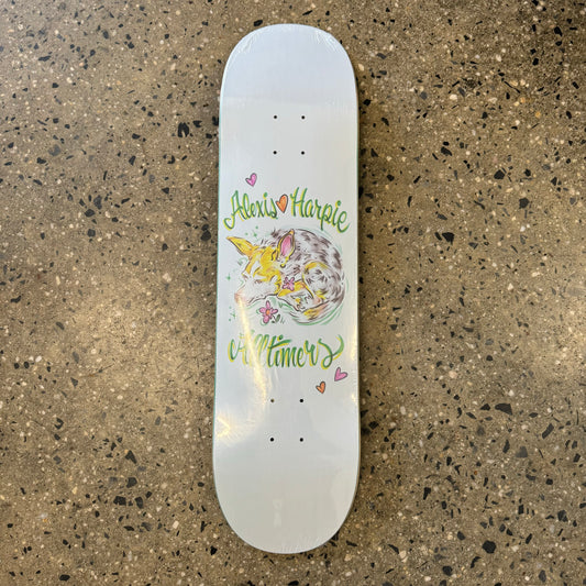 white skate deck with fox and green text