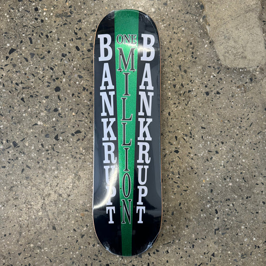 black skate deck with green and white text