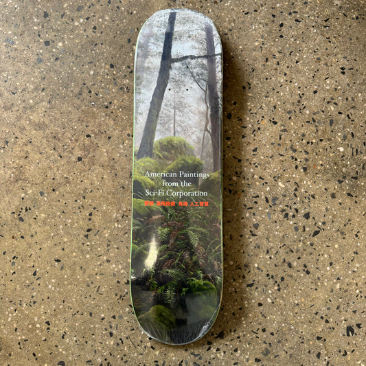 deck with all over printed illustration of a forest with white and red text
