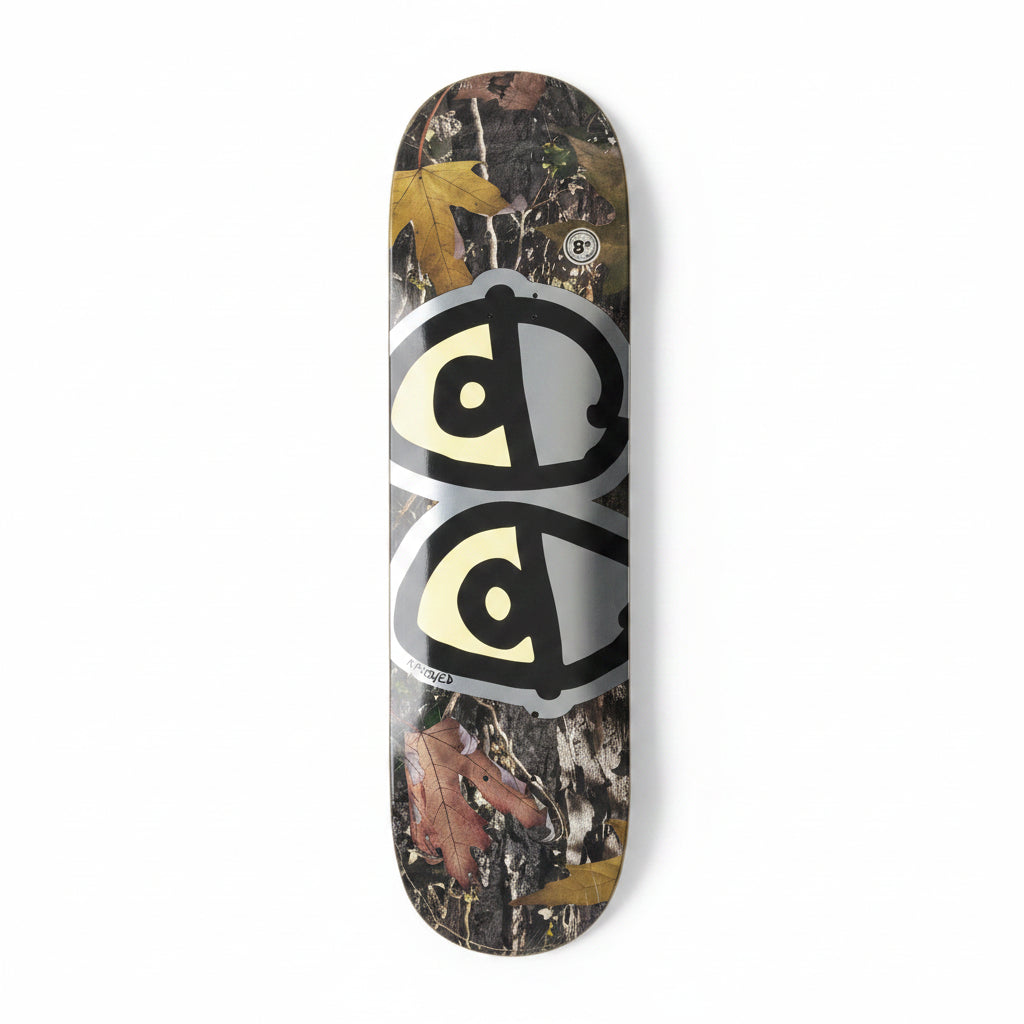 Skateboard deck with abstract design on a white surface