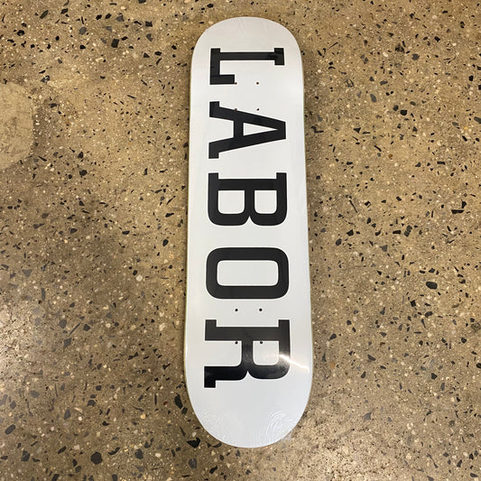 Bold LABOR type logo in black on white skate deck