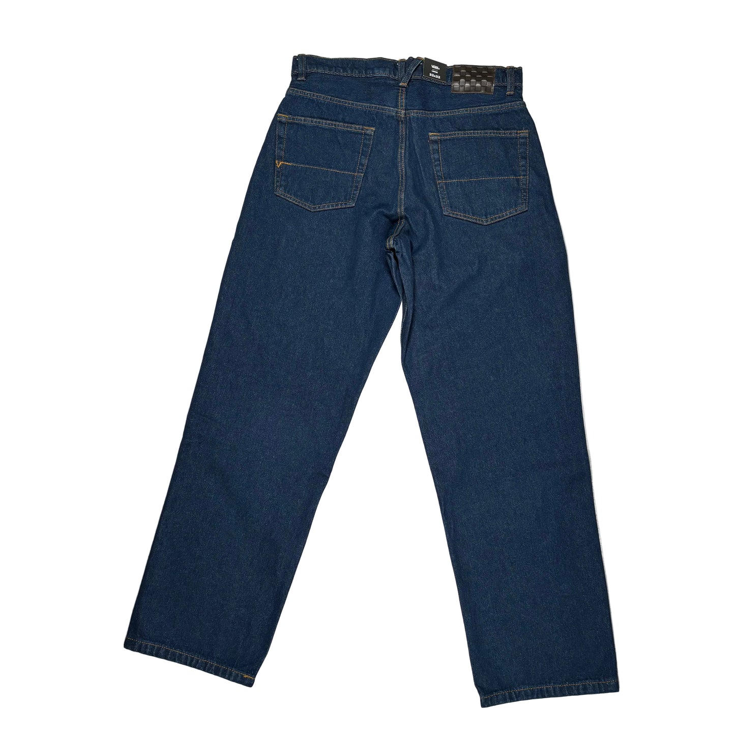 Blue jeans laid flat on a white background