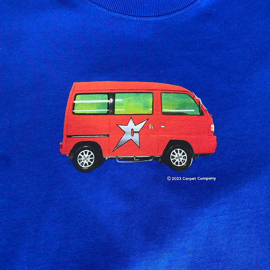 zoomed in view of red vans logo on royal blue t-shirt
