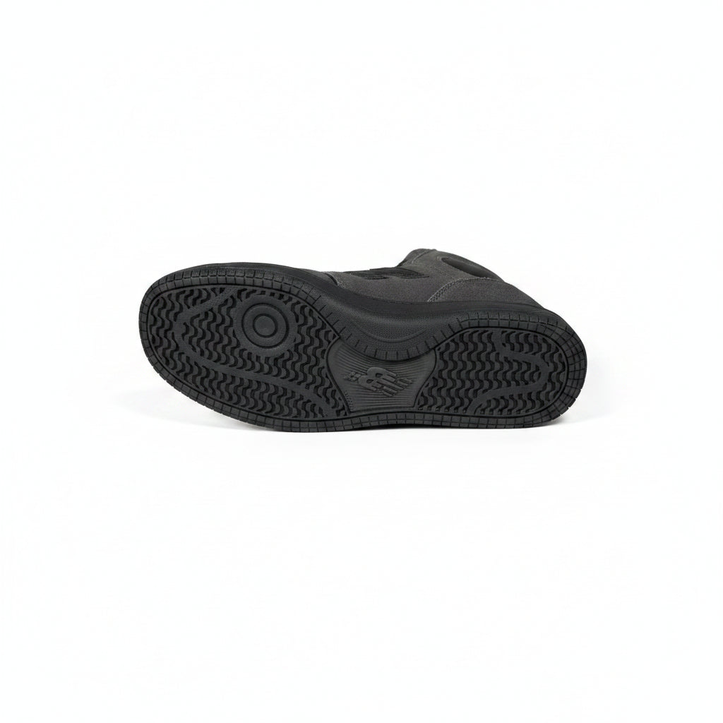 Black high-top sneaker sole on a white background