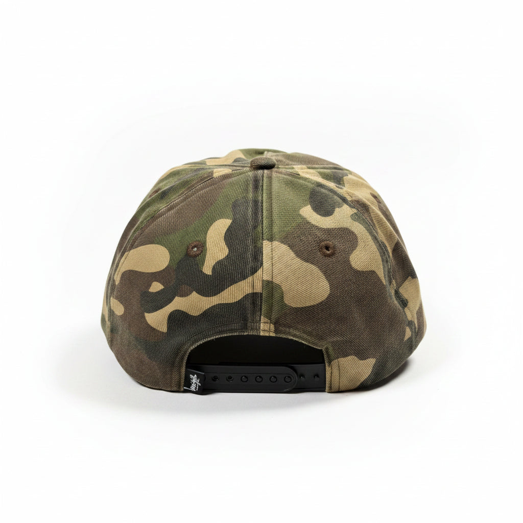 Camouflage-patterned cap on a white surface