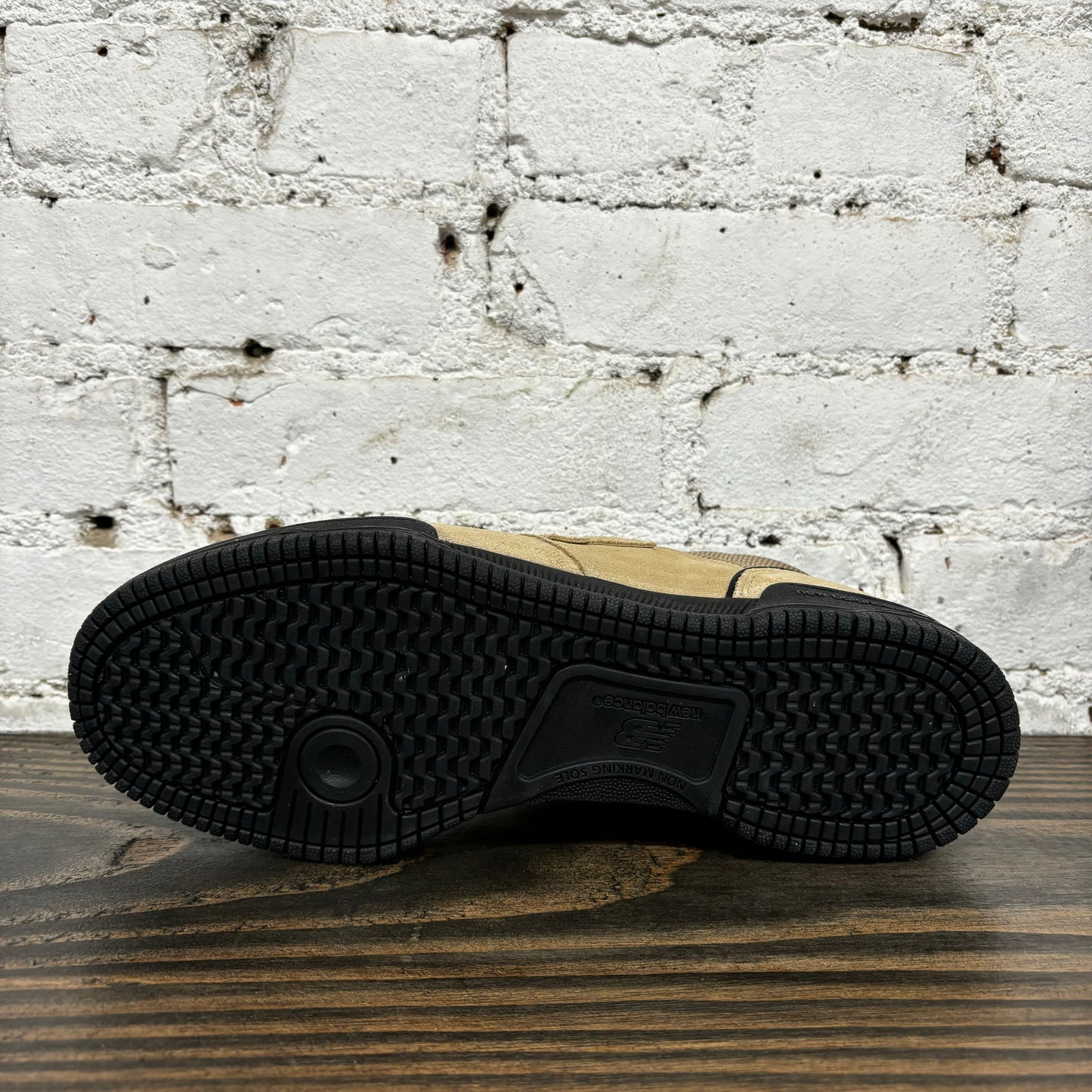 view of black gum rubber cupsole outsole on skateboard sneaker