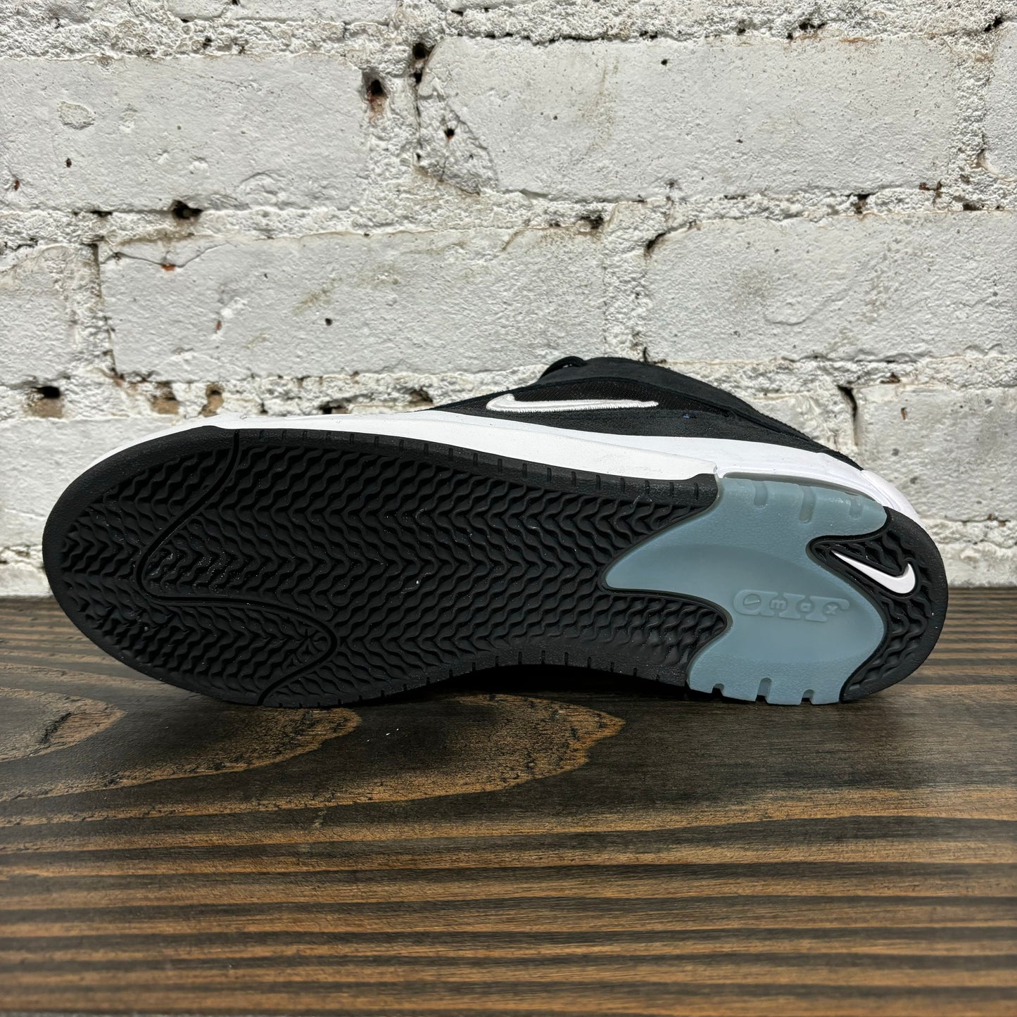 view of outsole on black and white suede and mesh skateboard sneaker