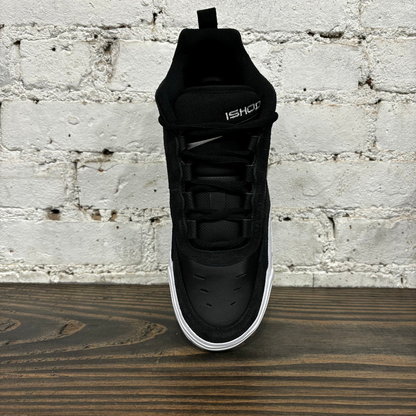 top down view of black and white suede and mesh skateboard sneaker