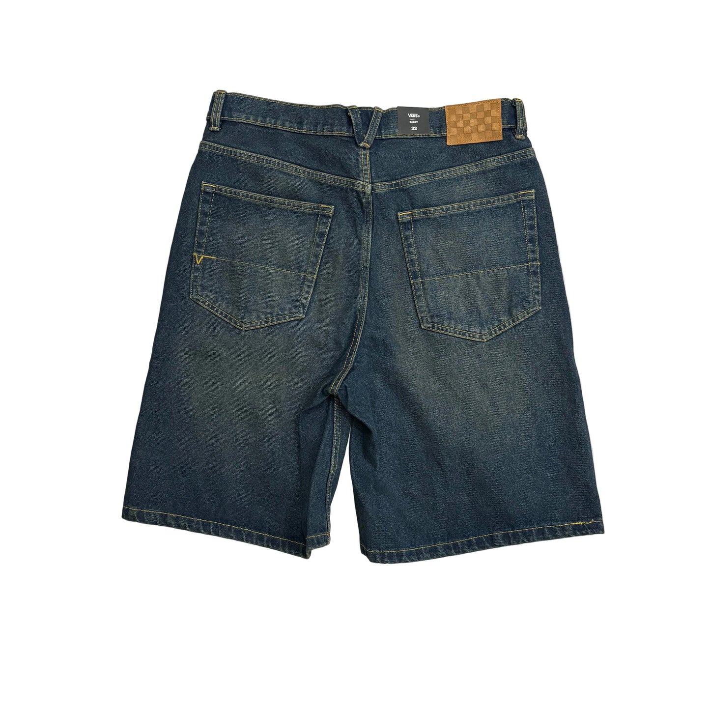 Back view of dark blue denim shorts with a brown patch on the waistband, laid flat on a white surface
