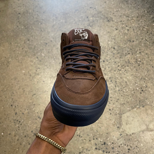 top down view of brown mid top skate shoe, laces and toe box visible