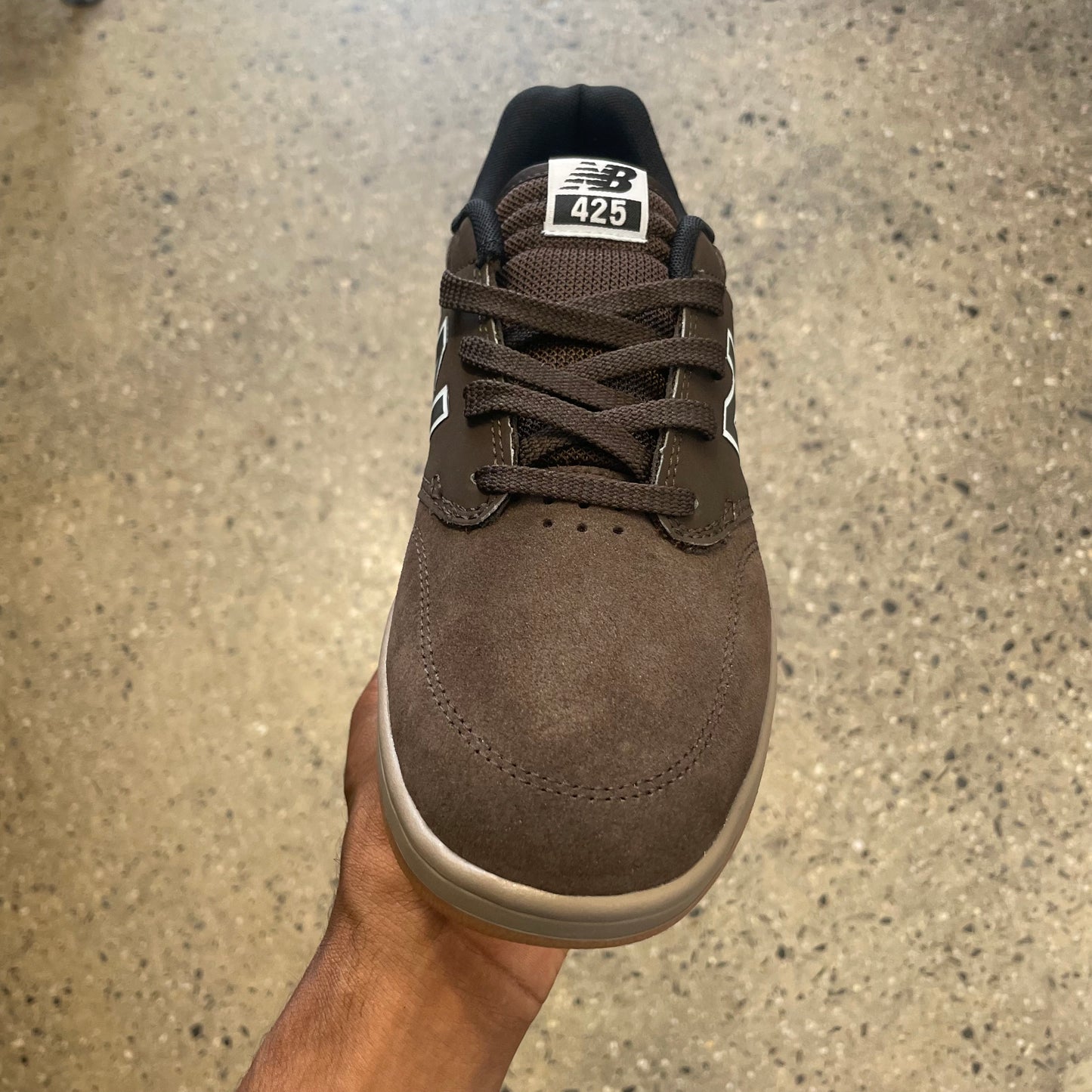 brown suede sneaker with beige sole, front view
