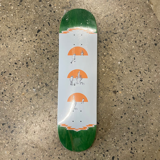 Orange and white desert graphic on green woodgrain skate deck