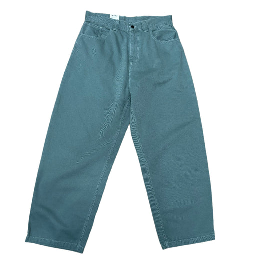 Front view of baggy light green pants