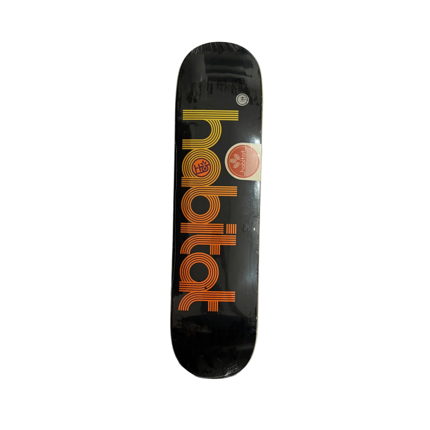 A black skateboard deck with 'habitat' printed vertically in orange and yellow stripes, white surface.