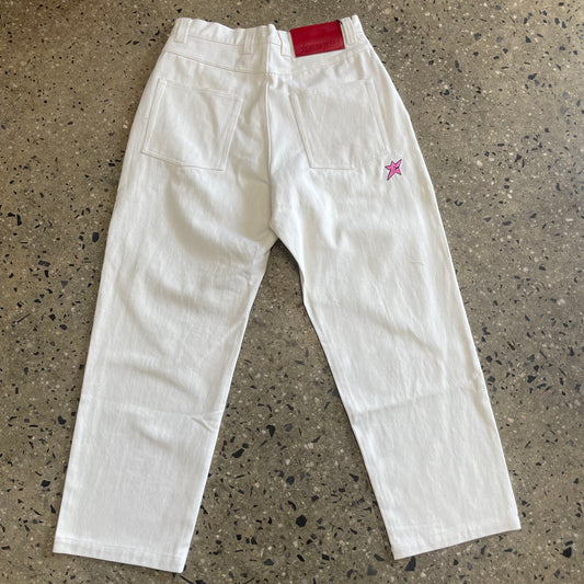 rear view of white denim pant with red label and pink c-star logo