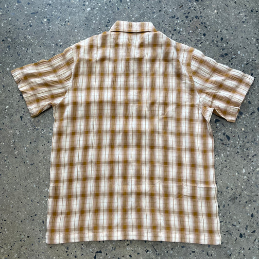 back view of golden brown plaid short sleeve shirt