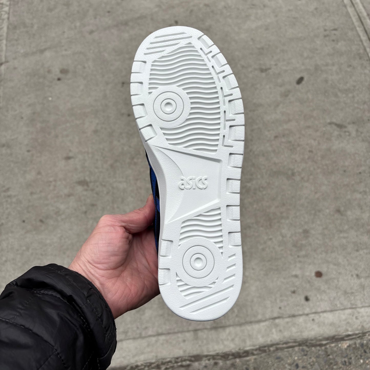 view of white outsole on suede skateboard shoe
