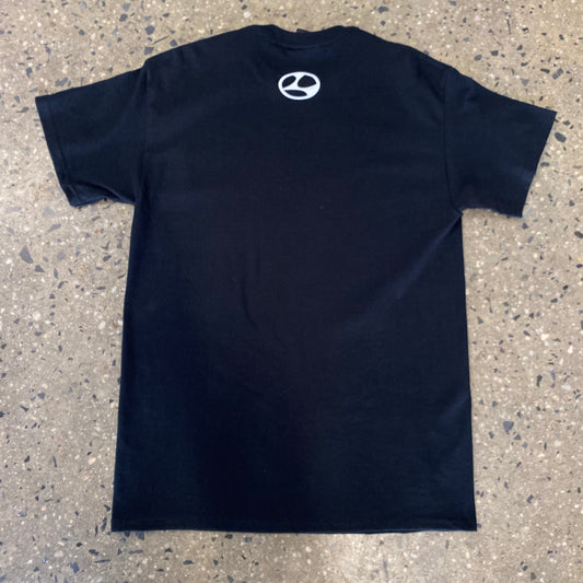 rear of black t-shirt with limosine L and circle logo on upper center of t-shirt near collar
