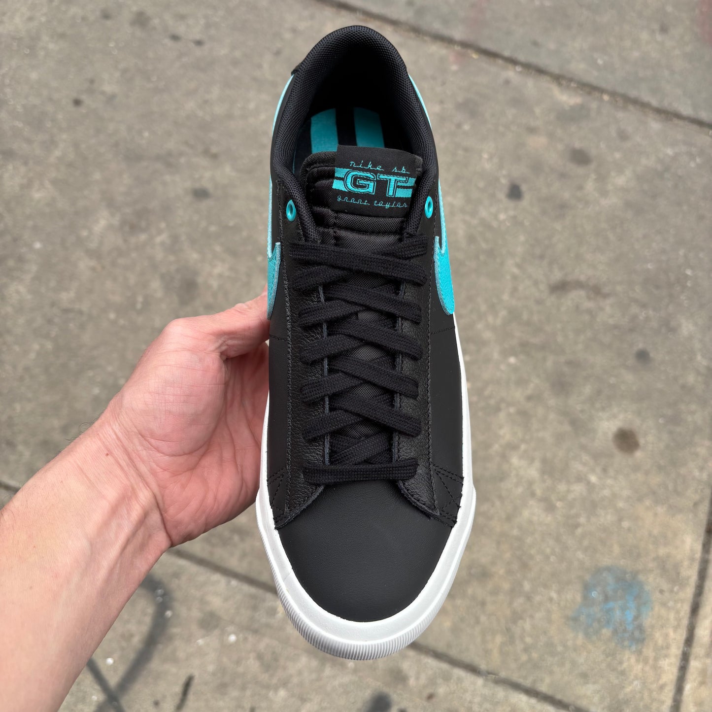 top down view of black and teal leather GT blazer low