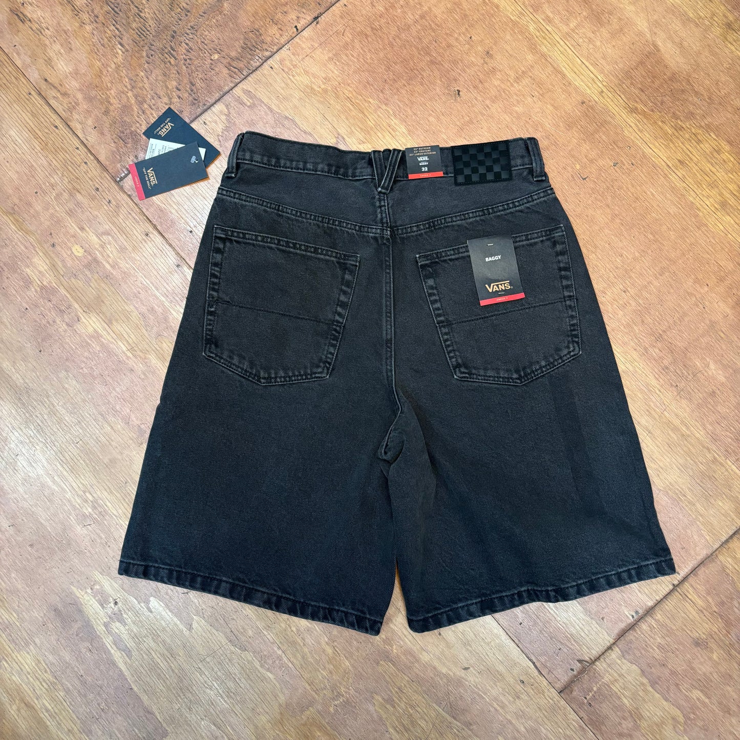 rear view of washed black baggy denim shorts