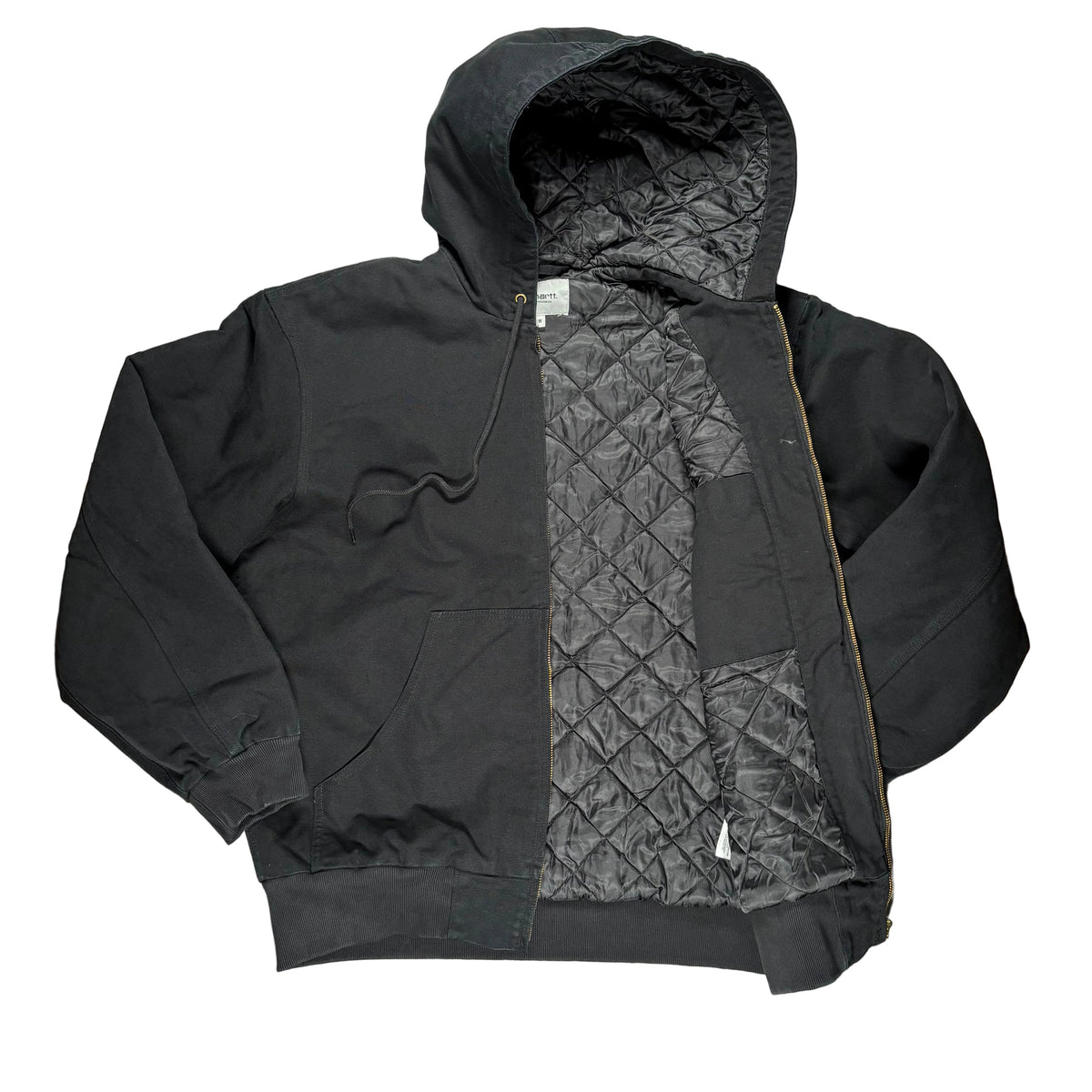 A black hooded jacket with a diamond-quilted black lining, laid flat on a white surface.
