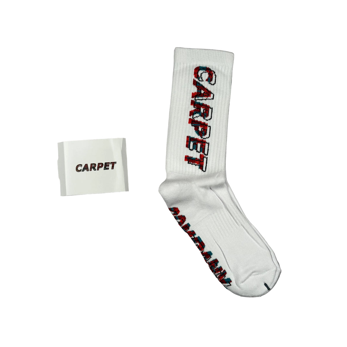 A single white crew sock with 'CARPET' printed vertically in red and black outlined lettering, shown next to a small white tag that also reads 'CARPET' on a white background.