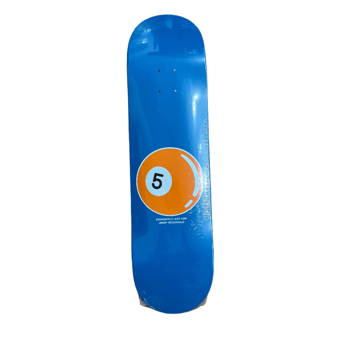 blue skateboard deck with orange 5 ball on lower portion of deck