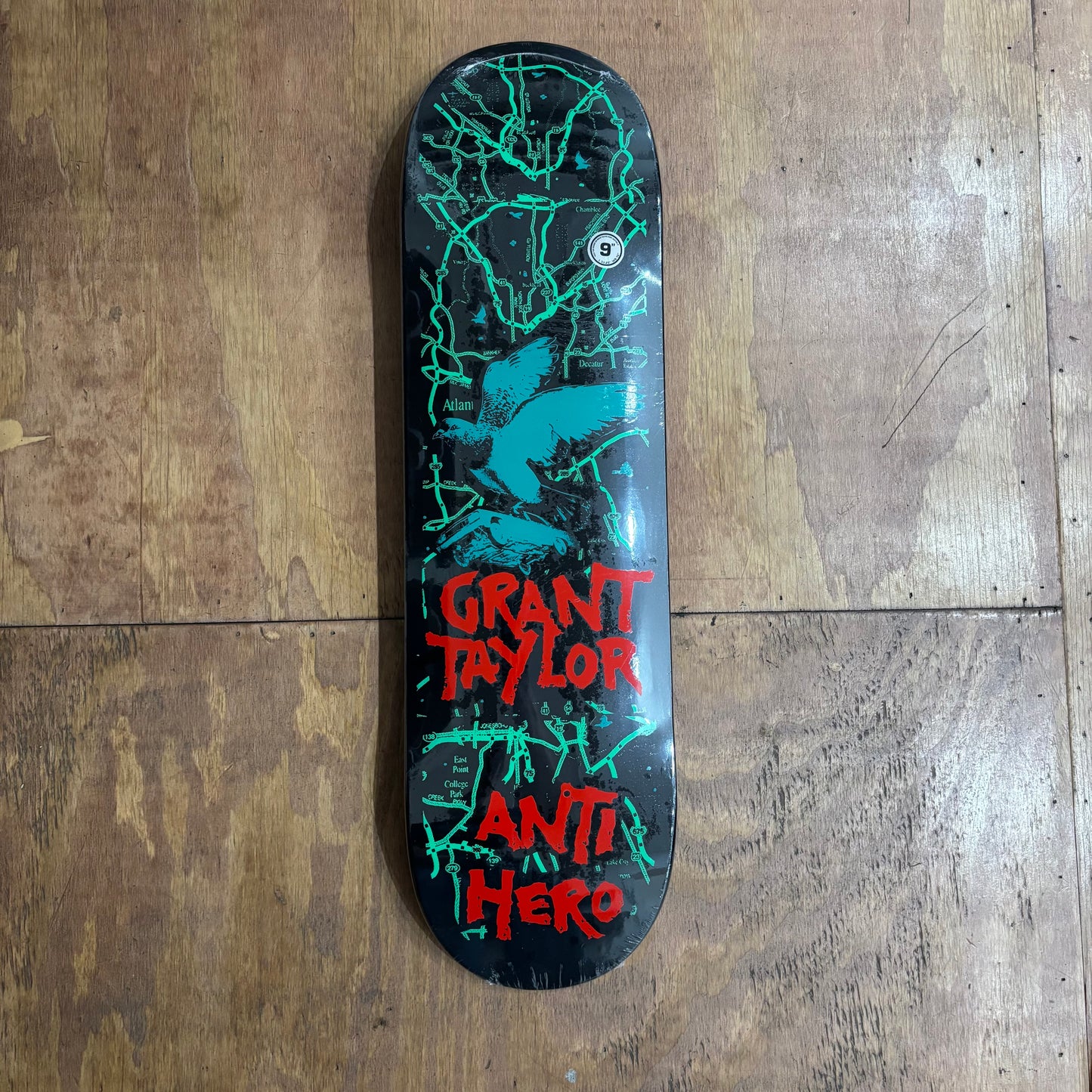 grant taylor green and red and black skateboard deck wiith a bird size 9.0